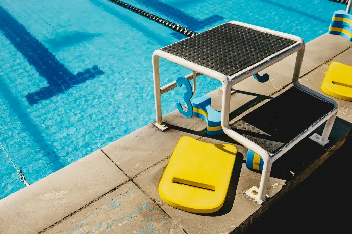 white and blue swimming pool chair